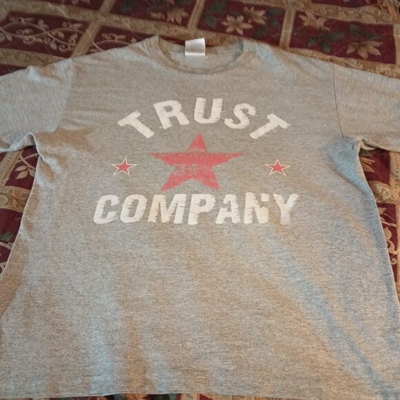 1. It is a Grunge Rock Band Trust Company t-shirt. The size is a Men's Medium. - Picture 1 of 3